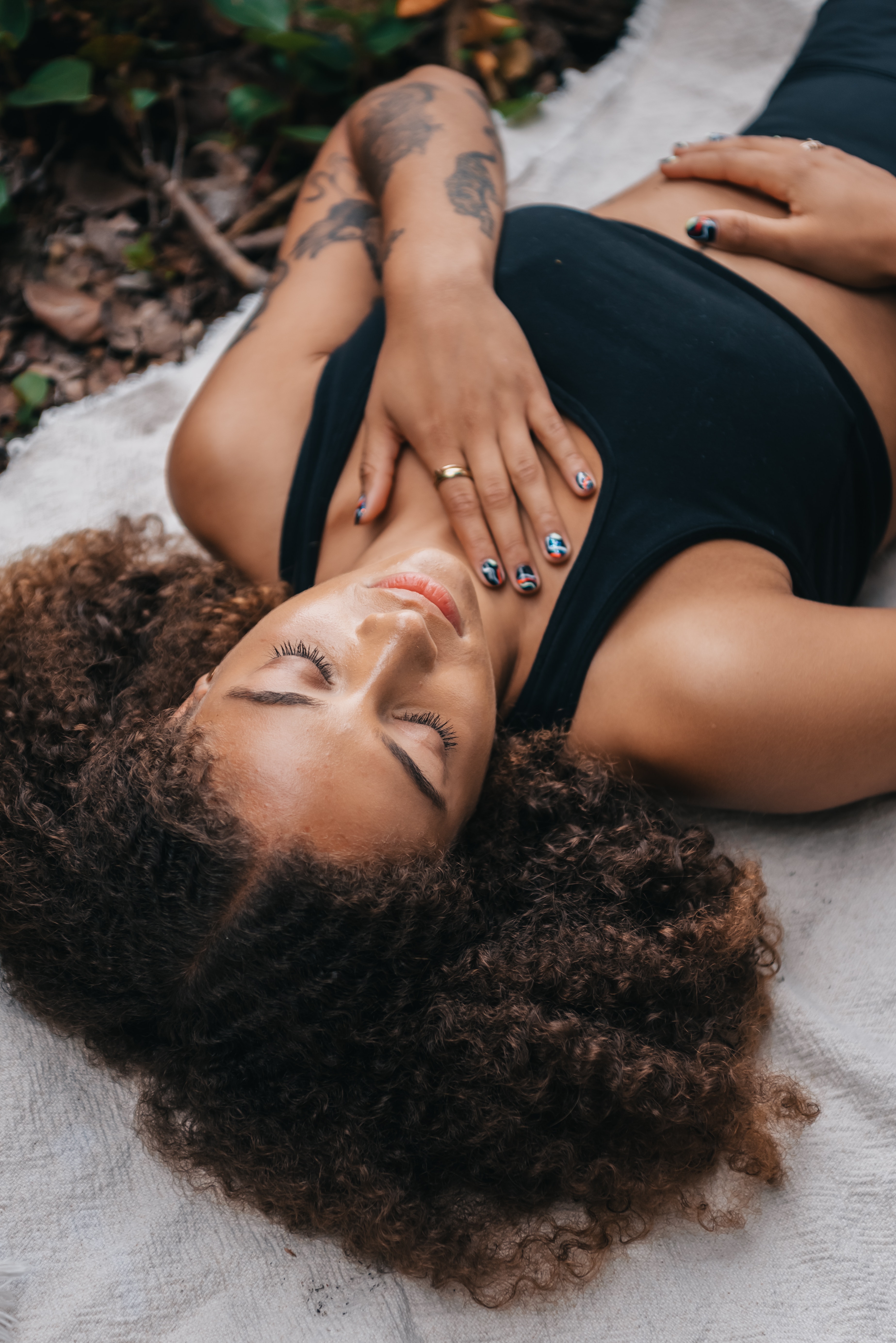 a photo of a woman breathing while laying down